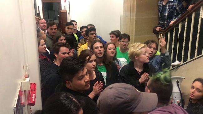 A video grab of protestors blocking the entrance to a talk by Bettina Arndt at Sydney University Tuesday September 11.Riot Squad police move on protestors at the University of Sydney