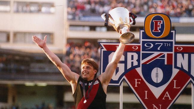 Mark “Bomber” Thompson holds the 1993 AFL premiership cup aloft in 1993. Picture: John Feder