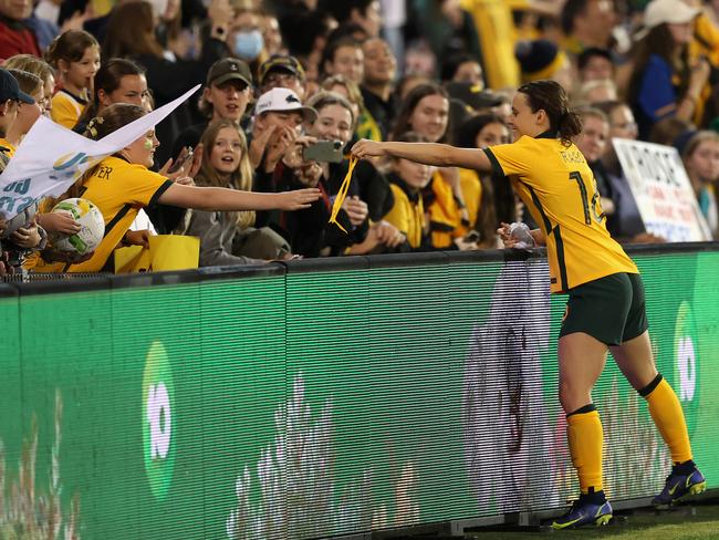 The ribbon handover is the highlight of the night for one lucky fan. Picture: Ashley Feder/Getty Images