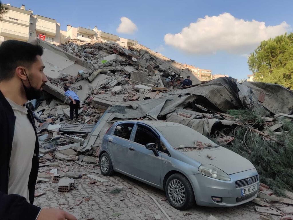 A view of a quake damaged site right after a quake shook Turkey's Aegean Sea coast, in Izmir, Turkey. Picture: Mehmet Emin Menguarslan