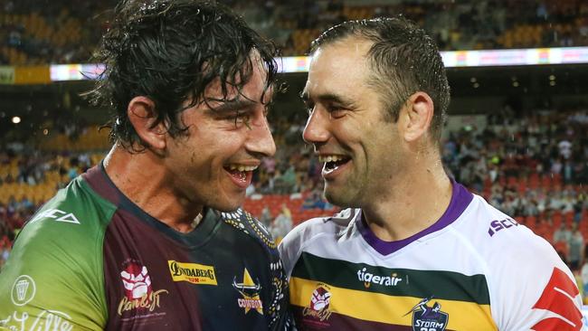 BRISBANE, AUSTRALIA - FEBRUARY 23: North Queensland player Johnathan Thurston and Melbourne player Cameron Smith laugh after the NRL trial match and Jonathan Thurston/Cameron Smith Testimonial match between the Melbourne Storm and the North Queensland Cowboys at Suncorp Stadium on February 23, 2018 in Brisbane, Australia. (Photo by Jono Searle/Getty Images)