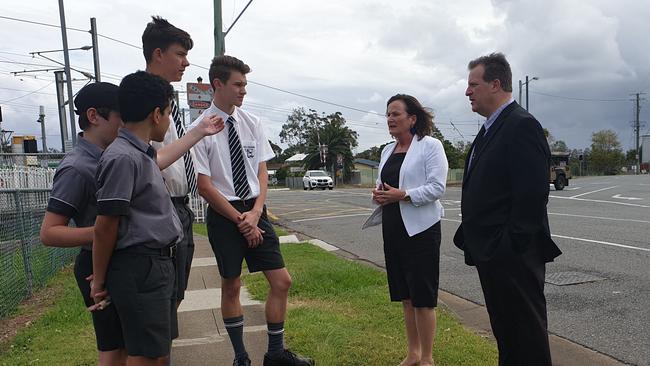 Joan Pease with Fr Michael Twigg and students from Iona College. Picture: Supplied