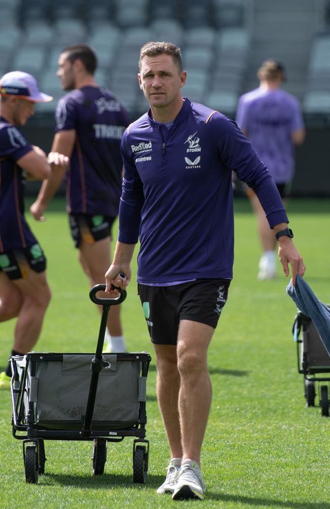 The recently retired skipper is used to leading his teammates through training drills on the Geelong surface, but his return to his professional home was spent carrying drinks and assisting with drills as the Storm squad prepares for the upcoming NRL season. Picture: Brad Fleet