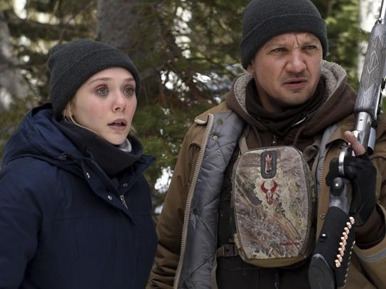 This image released by The Weinstein Company shows Elizabeth Olsen, left, and Jeremy Renner in a scene from "Wind River." (Fred Hayes/The Weinstein Company via AP)