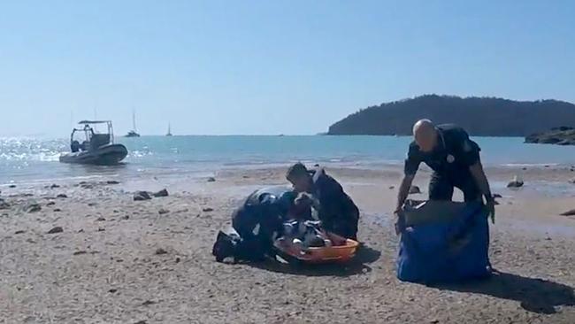 Paramedics frantically working to save Hannah’s life after the shark attack. Picture: RACQ CQ Rescue