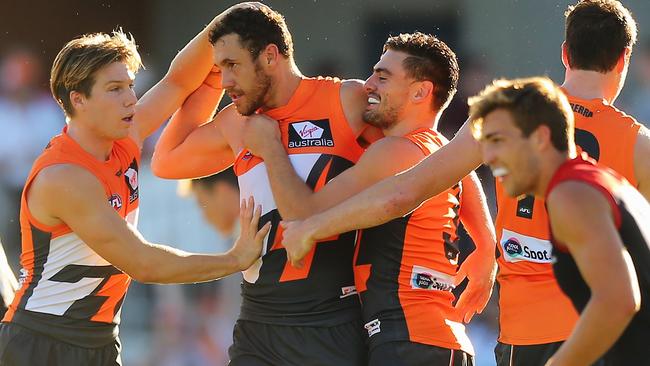 Shane Mumford celebrates a goal with teammate.