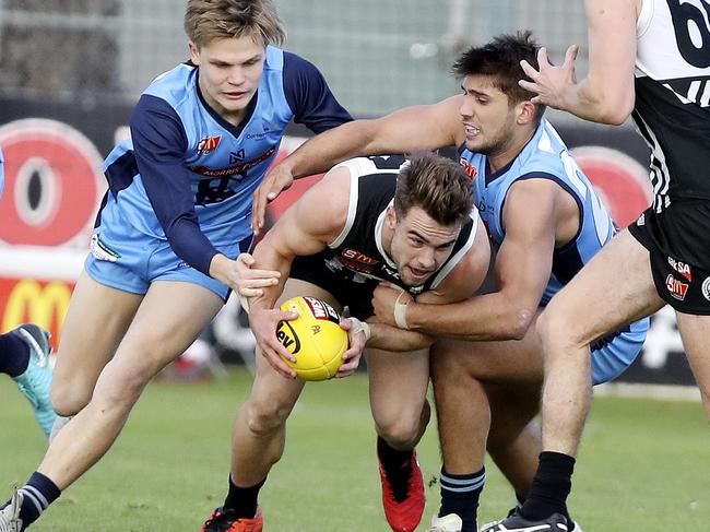 Delisted Port Adelaide player Will Snelling (pictured with the ball) will return to West Adelaide if he is not handed an AFL lifeline. Picture Sarah Reed