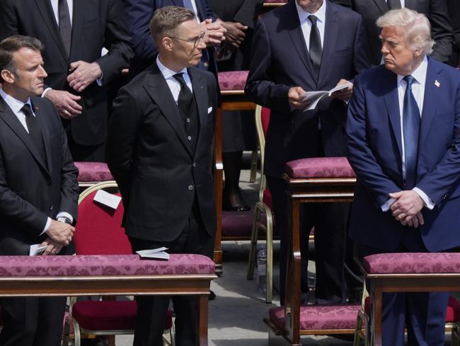 President Donald Trump, right, French President Emmanuel Macron, left, and Finland's President Alexander Stubb, attend the funeral of Pope Francis. Picture: AP