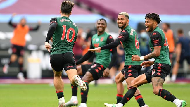 Tyrone Mings, right, celebrates with Aston Villa teammates during a match against West Ham at London Stadium last month. Picture: Getty Images