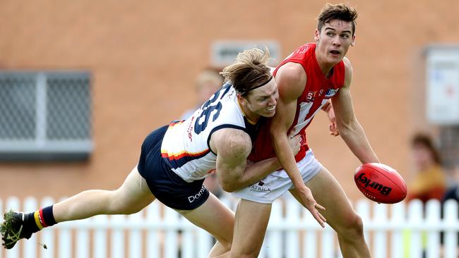 North’s Connor Rozee is tackled by Adelaide’s James Loneragan at Prospect Oval. Picture Calum Robertson.