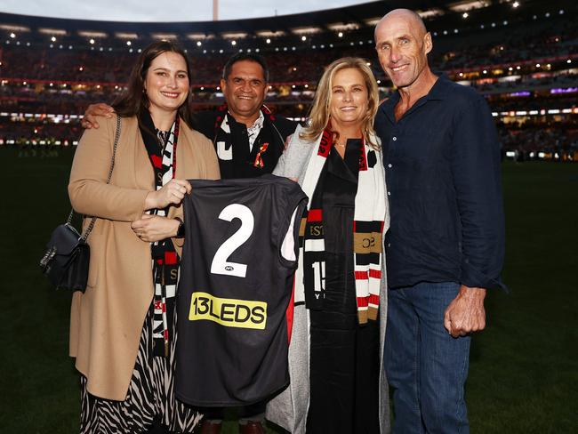 Chelsea and Anita Frawley hold Danny’s No. 2 jumper with Nicky Winmar and Tony Lockett. Picture: Michael Klein