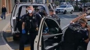 Police at Noosa Civic Shopping Centre after the possible COVID-19 breach. Picture: Valerio Conti via ABC