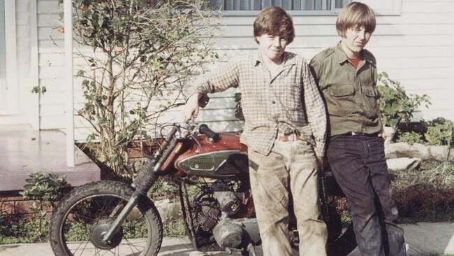 Wayne Gardner (left) with a childhood friend and his first motorbike.