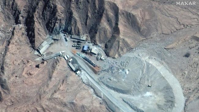 A satellite photo taken March 29 of the Chinese nuclear test site at Lop Nur. A cement truck is near the tunnel entrance and piles of dirt are on the spoil pile. Picture: Maxar Technologies