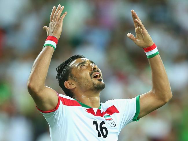 MELBOURNE, AUSTRALIA - JANUARY 11: Reza Ghoochannejhad of Iran gestures after having a goal ruled offside during the 2015 Asian Cup match between IR Iran and Bahrain at AAMI Park on January 11, 2015 in Melbourne, Australia. (Photo by Quinn Rooney/Getty Images)