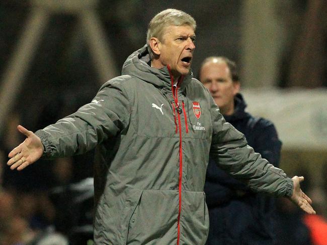 Arsenal's French manager Arsene Wenger gestures on the touchline during the English FA Cup third round football match between Preston North End and Arsenal at Deepdale in north west England on January 7, 2017. / AFP PHOTO / Lindsey PARNABY / RESTRICTED TO EDITORIAL USE. No use with unauthorized audio, video, data, fixture lists, club/league logos or 'live' services. Online in-match use limited to 75 images, no video emulation. No use in betting, games or single club/league/player publications. /