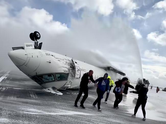 Images shot  by passenger Pete Koukov who was on a Delta Air Lines plane that crashed while landing Monday afternoon at the snowy Toronto Pearson International Airport. Picture: Pete Koukov/@eggxit Instagram