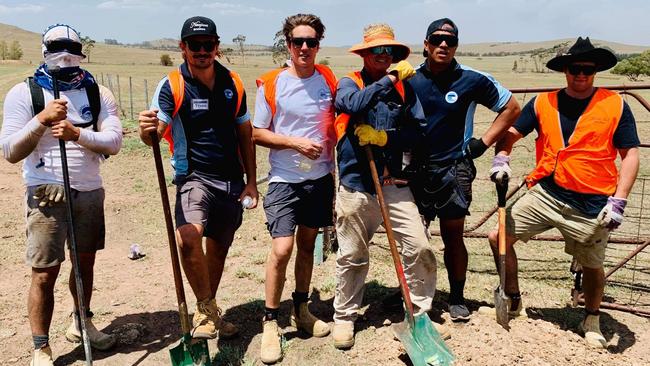 Players from the Newport Breakers rugby club — (LEFT TO RIGHT) Kenny Vuata, Tynan Linton, Sebastian James, Ian Crutch, James Vanisi and Tenny James — work in 42 degree heat, as volunteers for Blaze Aid, to remove and replace kilometres of damaged farm fencing destroyed by a bushfire on a property near Braidwood. Picture: Supplied