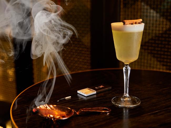 QT Sydney’s The Gilt Lounge serve up a smokin’ Spiced Apple Sour