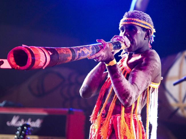 An Aboriginal musician playing the didgeridoo at the Barunga Festival.Featuring the Barunga art prize, an international didgeridoo competition, story telling circle and outstanding displays of sporting prowess in AFL, softball and basketball, Barunga Festival is a unique blend of music, sport and culture, with a strong emphasis on cultural exchange and collaboration.Photo - Tourism NTEscape 30 April 2023Festival cover story