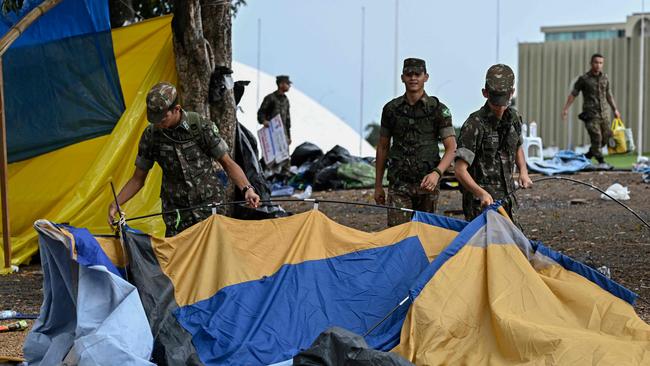 Soldiers dismantle the camp set up by supporters of Brazil's ex-president Jair Bolsonaro in front of the Army headquarters in Brasilia. Picture: AFP