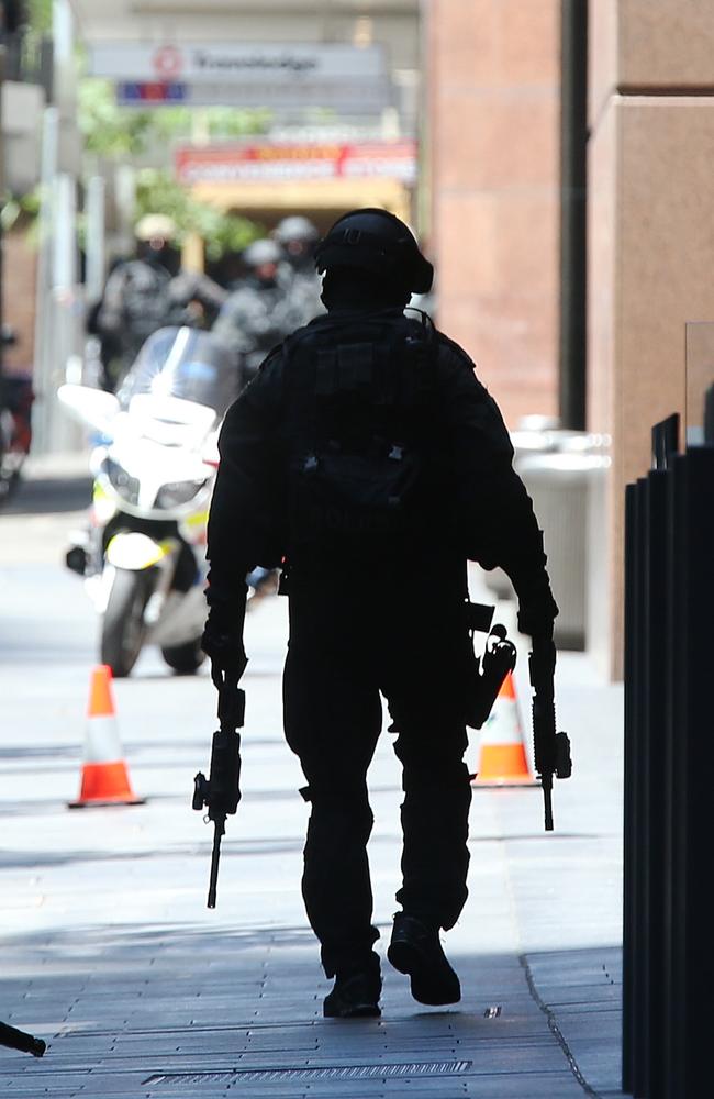 Armed gunmen are holding hostages inside the Lindt cafe in Martin Place in Sydney, believed to be holding ISIS flags. Picture: Toby Zerna