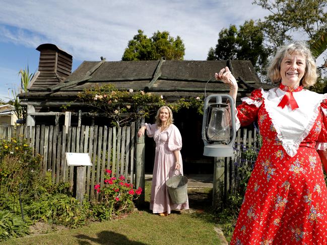 Volunteers Lynette Wilson (left) and Pam Hill pose in front of the Veivers early settlers cottage on display at the Gold Coast Historical Museum during the open day, Sunday, July 9, 2023. Photo: Regi Varghese