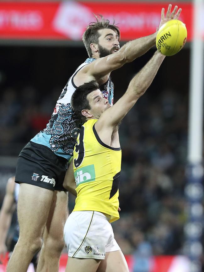 Justin Westhoff rucks over Richmond captain Trent Cotchin. Picture Sarah Reed