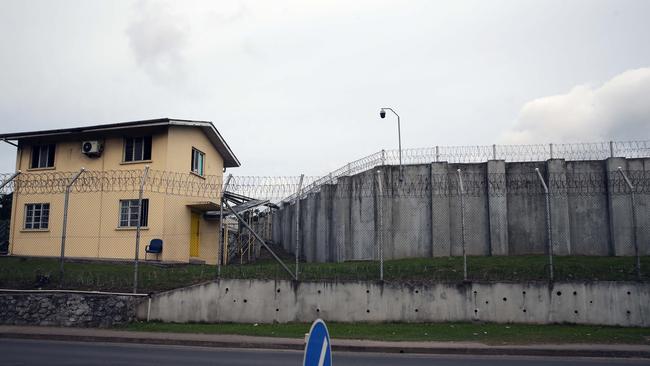 Concrete walls topped with coils of barbered wire surround John Nikolic at notorious Suva prison. Picture: Gary Ramage