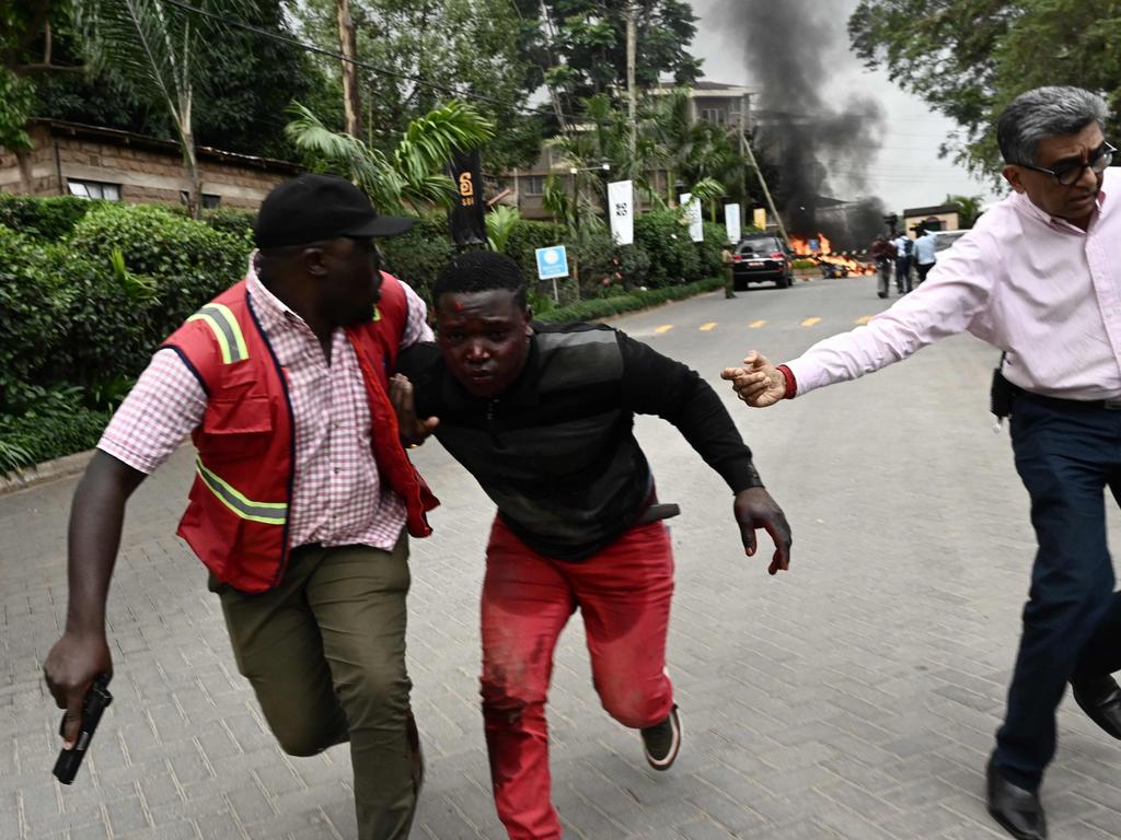 An injured man is evacuated from the scene of an explosion at a hotel complex in Nairobi's Westlands suburb. Picture: AFP