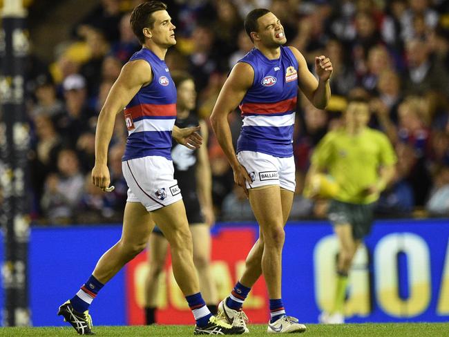 Jason Johannisen goes from the field with a hamstring injury.