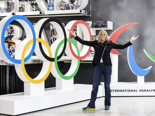 Brisbane 2032 Olympic Organising Committee CEO, Cindy Hook, with the Olympic Rings and Paralympic Agitos structures, made by Bailey Print Group in Salisbury.  This is part of the Ã¢â¬Ë9 years to goÃ¢â¬â¢ celebrations for the Brisbane 2032 Olympics.