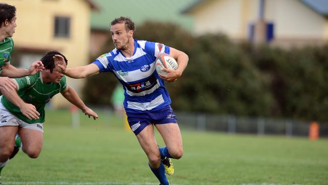 Harvey Bell pushes past an opposition player from Lennox Head. Photo Cathy Adams.