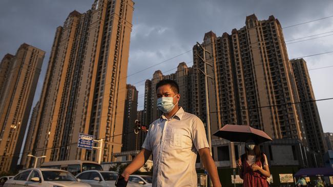 A man pictured walking through the Evergrande Changqing community. Picture: Getty Images