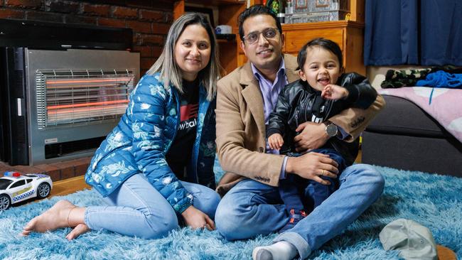 Khagendra and Ishu Satyal with their son Agrim at their home in Hobart. Picture: Peter Mathew