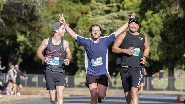 hayden Murphy, Patrick Foley- Donoghue and Patrick Pekin finish the Cadbury Half Marathon. Picture: Chris Kidd