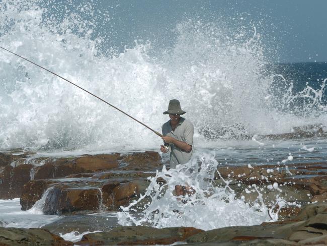 Rock fisherman at Avoca beach on the Central Coas not wearing a life jacket.