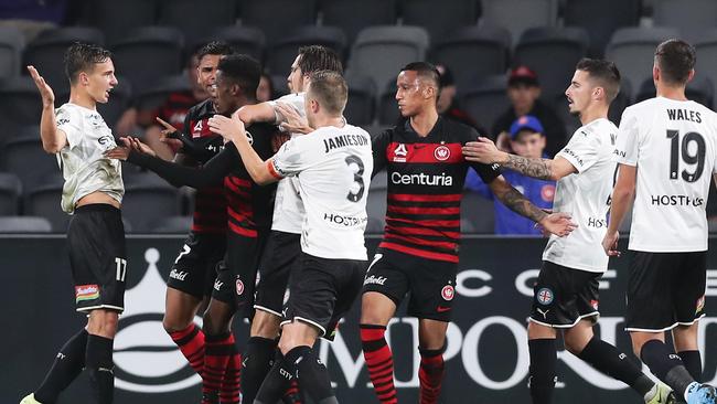 Melbourne City’s Denis Genreau, left, scuffles with Wanderers players in a fiery A-League clash at Bankwest Stadium Picture: Getty Images