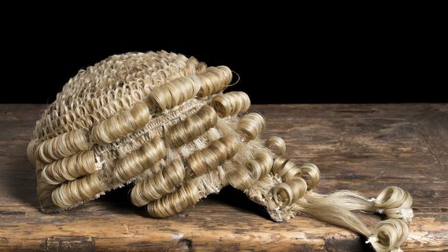 Genuine horsehair barrister's wig on an antique desk