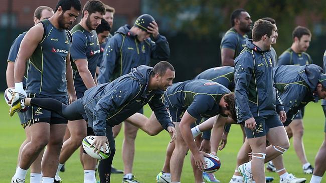 Quade Cooper and his Wallaby teammates warm up during a training session in London this week.