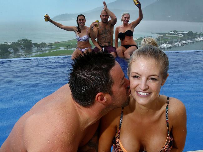 Newly weds Christian Zelvis, 36, and Renee Zelvis, 33 of Maroubra, joined by family and friends defy cyclone Debbie and continue to enjoy their honeymoon at Airlie Beach. Picture: Liam Kidston.