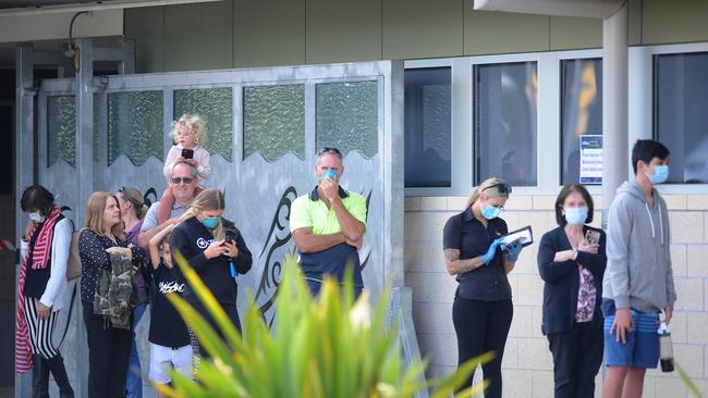 People lined up at the Brown Plains community health centre. Picture: John Gass