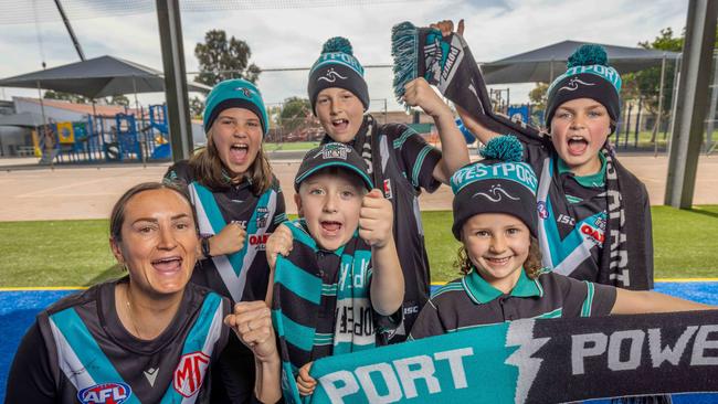 Westport Primary School deputy principal Lisa Craddock with Imogen, Louis, Asher, Brody, and Harlo ready for the big do-or-die clash against Hawthorn. Picture: Ben Clark