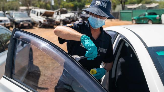 Police conducting a forensic investigation of a car that has been stolen in the Darwin area. Picture: Pema Tamang Pakhrin