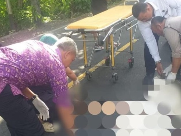An Australian tourist has died in a horror hit and run accident on a remote road in Bali.