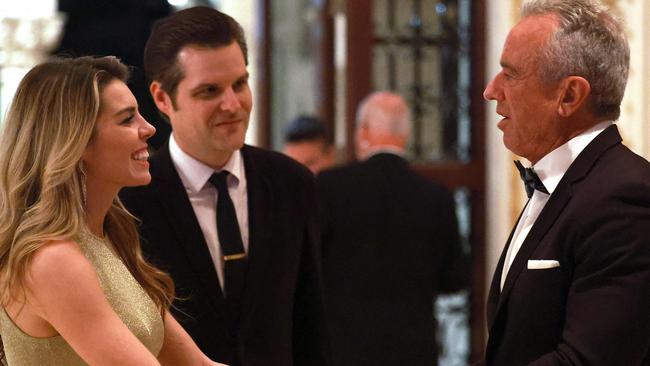 Mr Gaetz and his wife, Ginger Luckey Gaetz, hobnobbing with Mr Trump’s nominee to run the American Health Department, anti-vaxxer Robert F. Kennedy Jr. Picture: Joe Raedle/Getty Images via AFP