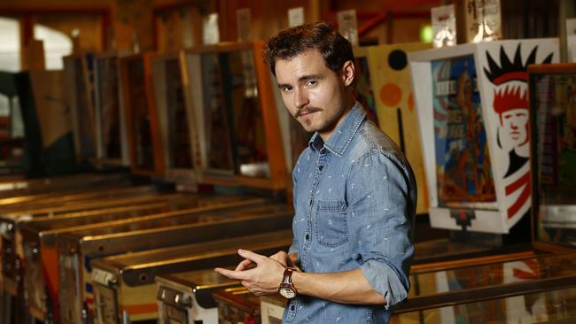 Callan McAuliffe in front of the Classic pinball machines at Coney Island, Luna Park. Picture: John Appleyard