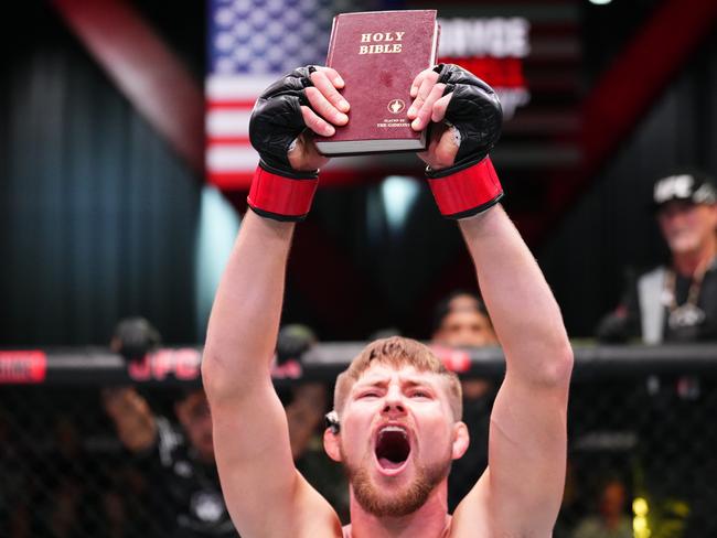 Bryce Mitchell celebrates his win over Dan Ige last year with a Bible. Picture: Getty Images