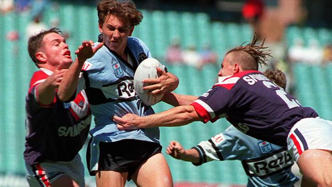 Mat Rogers hits it up for Cronulla’s Presidents Cup-winning team in 1994.