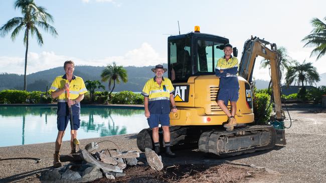 Workers on Hamilton Island Michael Strybis, Brian Blight and Michael Williams prepare for domestical arrivals from a rise in economic patriotism.